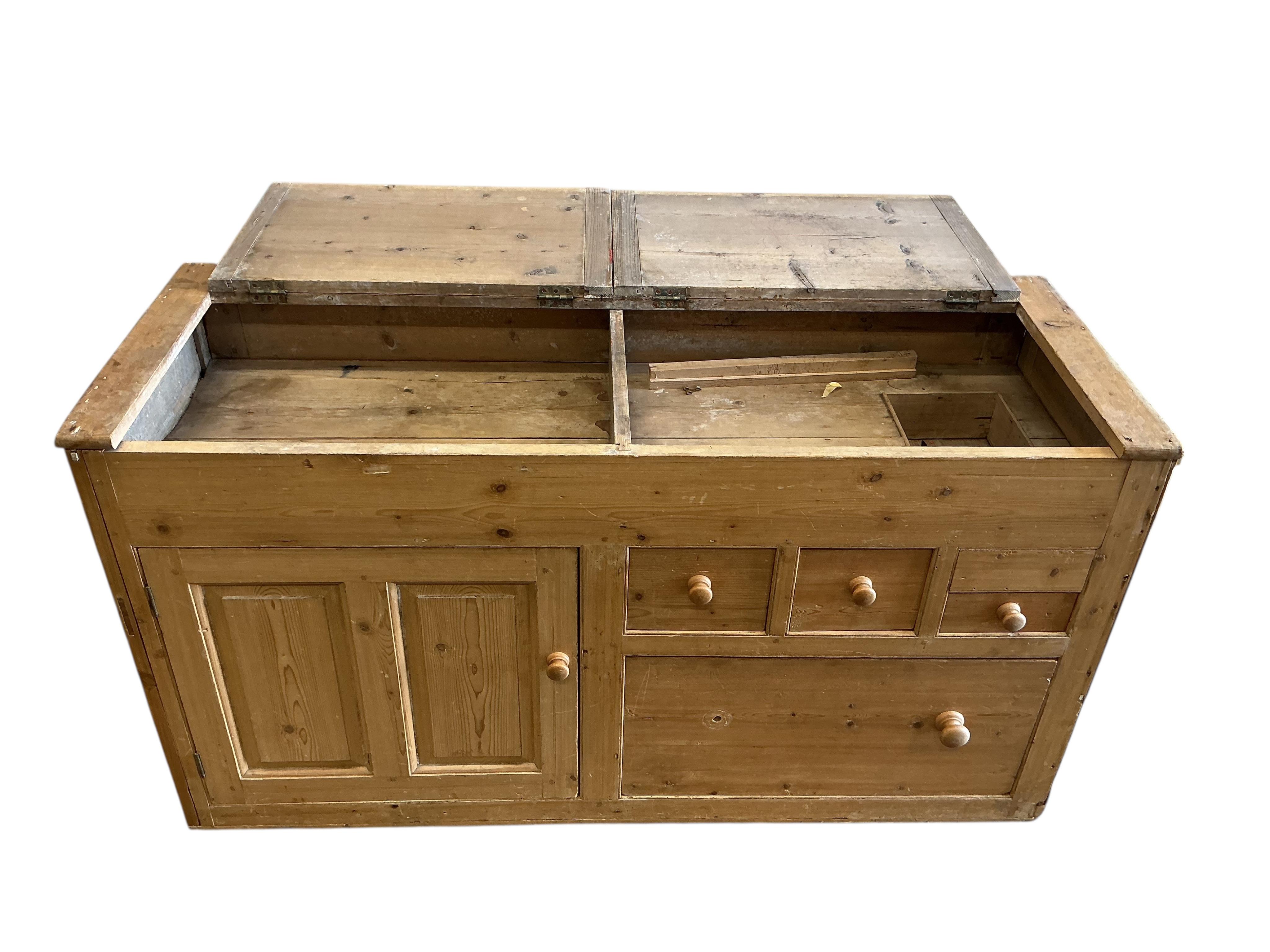 A Victorian pine low dresser with twin hinged compartment top, width 150cm, depth 53cm, height 80cm